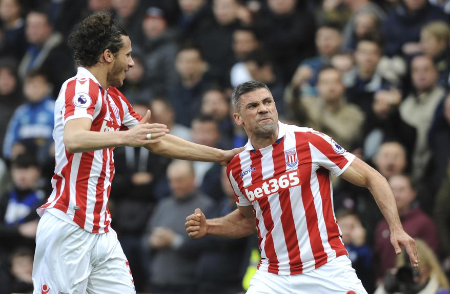 Stoke's Jonathan Walters, right, celebrates after scoring from the penalty spot during the English Premier League soccer match between Stoke City and Chelsea at the Britannia Stadium, Stoke on Trent, England, Saturday, March 18, 2017. (AP Photo/Rui Vieira)
