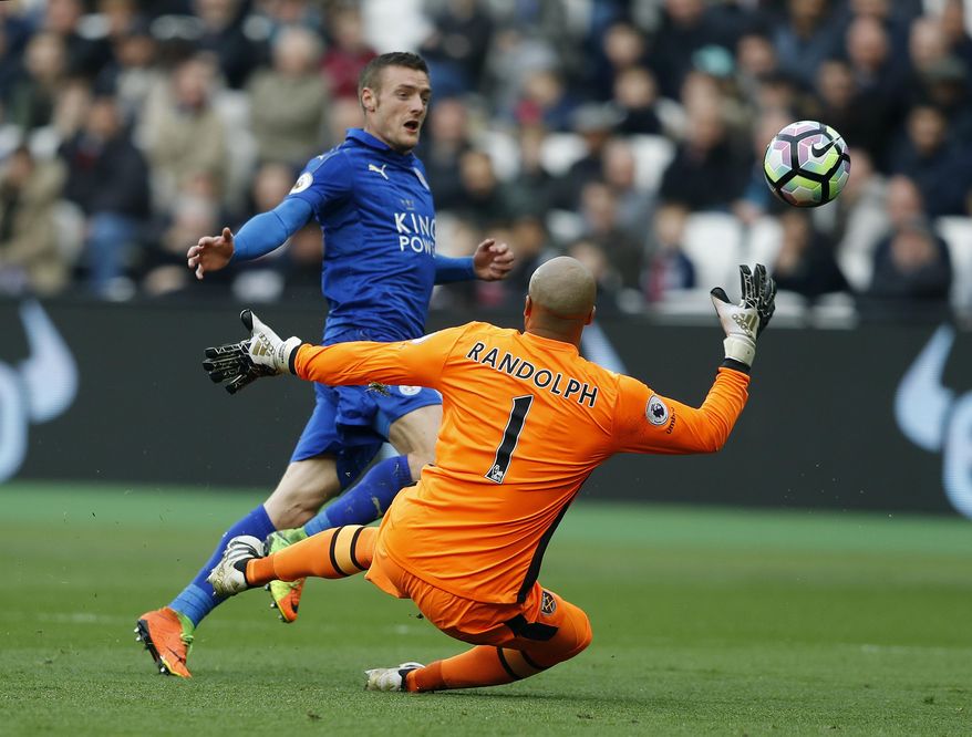 Leicester's Jamie Vardy, left, fails to score during the English Premier League soccer match between West Ham and Leicester City at London Stadium in London, Saturday, March 18, 2017. (AP Photo/Frank Augstein)