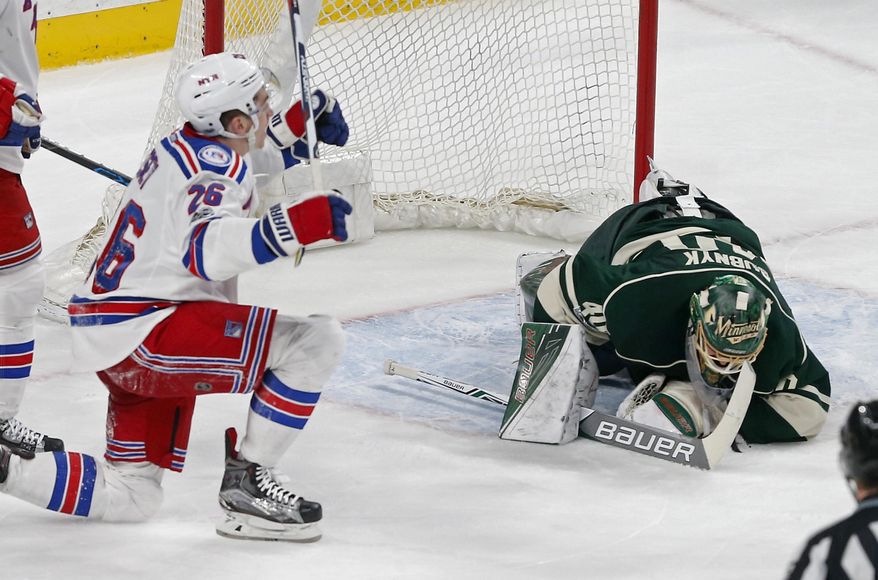New York Rangers&#39; Jimmy Vesey celebrates his goal against Minnesota Wild goalie Devan Dubnyk, right, during the second period of an NHL hockey game Saturday, March 18, 2017, in St. Paul, Minn. (AP Photo/Jim Mone)
