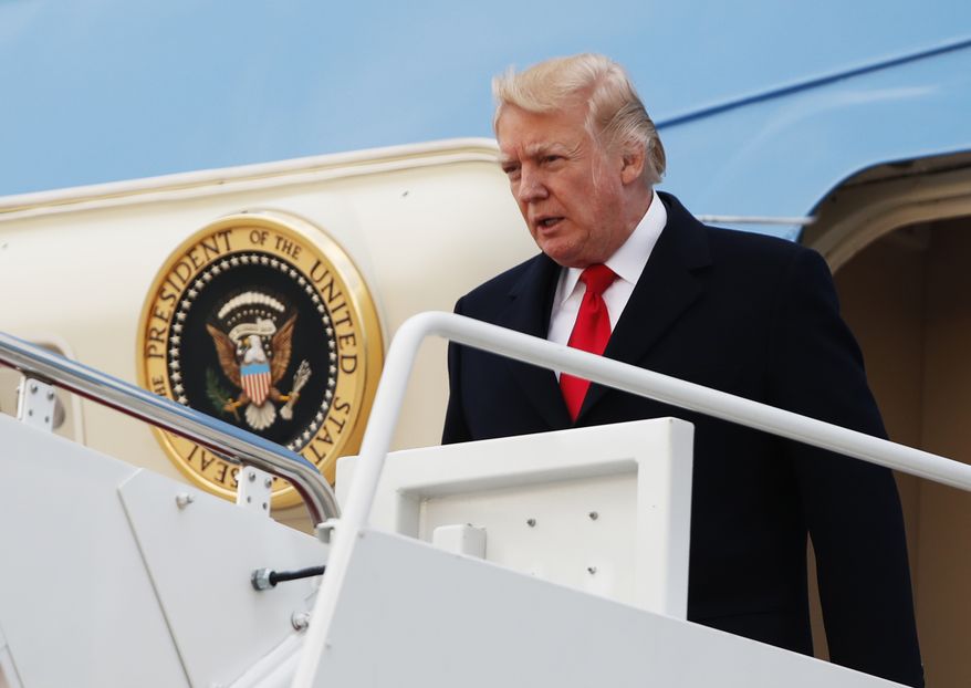 President Donald Trump disembarks Air Force One upon arrival at Andrews Air Force Base, Md., Sunday, March 19, 2017, from a trip to Florida. (AP Photo/Manuel Balce Ceneta)