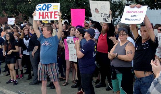 Protesters rallied last year outside the North Carolina Executive Mansion in Raleigh after the governor signed a bill that dealt a blow to the LGBT movement by preventing localities from passing anti-discrimination rules. (Associated Press)
