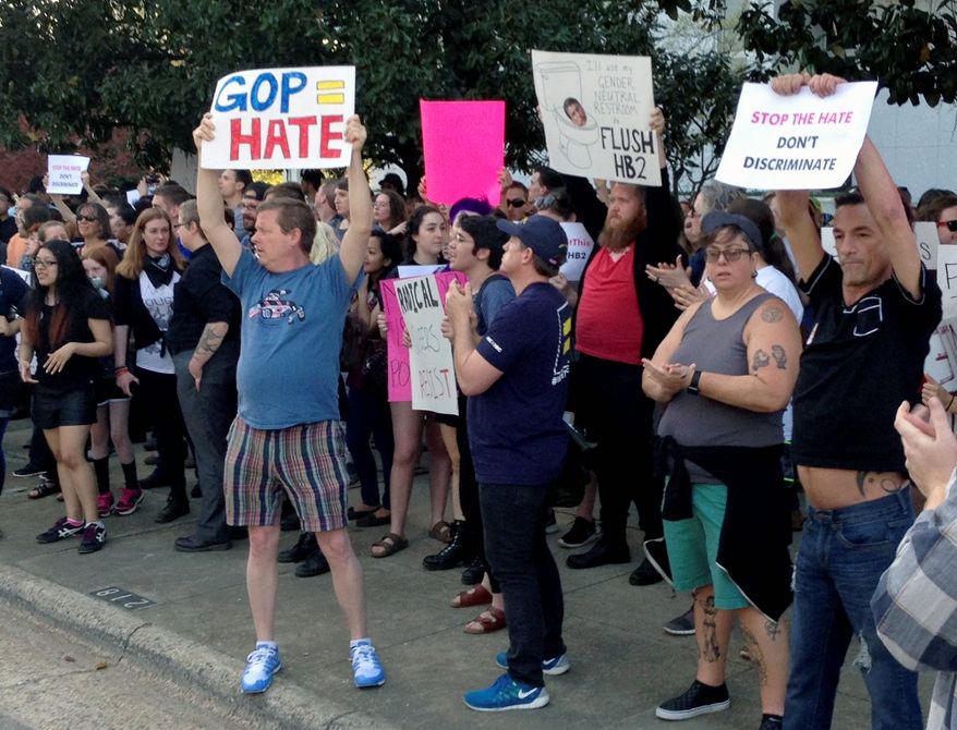 Protesters rallied last year outside the North Carolina Executive Mansion in Raleigh after the governor signed a bill that dealt a blow to the LGBT movement by preventing localities from passing anti-discrimination rules. (Associated Press)