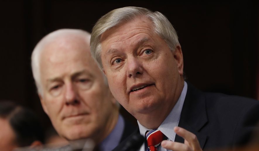 Senate Judiciary Committee member Sen. Lindsey Graham, R-S.C., right, accompanied by Sen. John Cornyn, R-Texas, speaks on Capitol Hill in Washington, Monday, March 20, 2017, during the committee&#x27;s confirmation hearing for Supreme Court Justice nominee Neil Gorsuch. (AP Photo/Pablo Martinez Monsivais) **FILE**