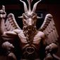 This 2014 photo provided by The Satanic Temple shows a bronze Baphomet, which depicts Satan as a goat-headed figure surrounded by two children. (The Satanic Temple via AP) ** FILE ** 