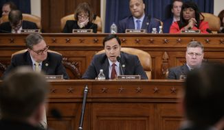 House Intelligence Committee member Rep. Joaquin Castro, D-Texas, center, flanked by Rep. Denny Heck, D-Wash., left, and Rep. Rick Crawford, R-Ark., questions FBI Director James Comey on Capitol Hill in Washington, Monday, March 20, 2017, during the committee&#x27;s hearing on allegations of Russian interference in the 2016 U.S. presidential election. (AP Photo/J. Scott Applewhite) ** FILE **