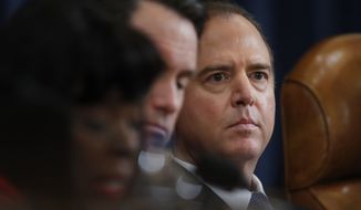 The House Intelligence Committees ranking member, Rep. Adam Schiff, D-Calif., right, sitting next to Committee Chairman Rep. Devin Nunes, R-Calif., listens to testimony from FBI Director James Comey and National Security Agency Director Michael Rogers on Capitol Hill in Washington, Monday, March 20, 2017, during the committee&#x27;s hearing on allegations of Russian interference in the 2016 U.S. presidential election. AP Photo/Manuel Balce Ceneta)