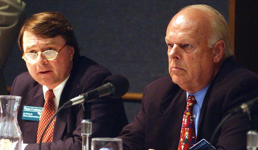 In this photo taken July 22, 2002, Wayne Creelman, left, gives his view on a question as Bob Eleveld listens a the GVSU Eberhardt Center in Grand Rapids, Mich. Eleveld, 80, has published his own obituary and scheduled his own memorial service after stopping cancer treatment. He announced that he will host a "celebration of life" open house on Saturday, March 18, 2017, in lieu of a funeral. (Yuli Wu/The Grand Rapids Press via AP)