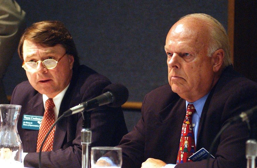 In this photo taken July 22, 2002, Wayne Creelman, left, gives his view on a question as Bob Eleveld listens a the GVSU Eberhardt Center in Grand Rapids, Mich. Eleveld, 80, has published his own obituary and scheduled his own memorial service after stopping cancer treatment. He announced that he will host a "celebration of life" open house on Saturday, March 18, 2017, in lieu of a funeral. (Yuli Wu/The Grand Rapids Press via AP)