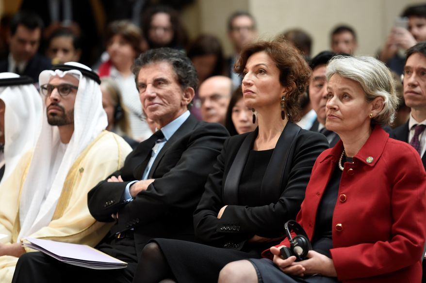 President of the Arab World Institute, Jack Lang, 2nd left, is seated with French Culture Minister Audrey Azoulay, 2nd right, and the director general of UNESCO Irina Bokova, as they listen to French President Francois Hollande delivering a speech at the International Donors' Conference for the Protection of Heritage in Armed Conflict at the Louvre Museum in Paris, France, Monday, March 20, 2017. France is trying to raise tens of millions of dollars from international donors to protect cultural heritage sites threatened by war and the kind of destruction carried out by Islamic State militants. (Stephane de Sakutin/Pool Photo via AP)