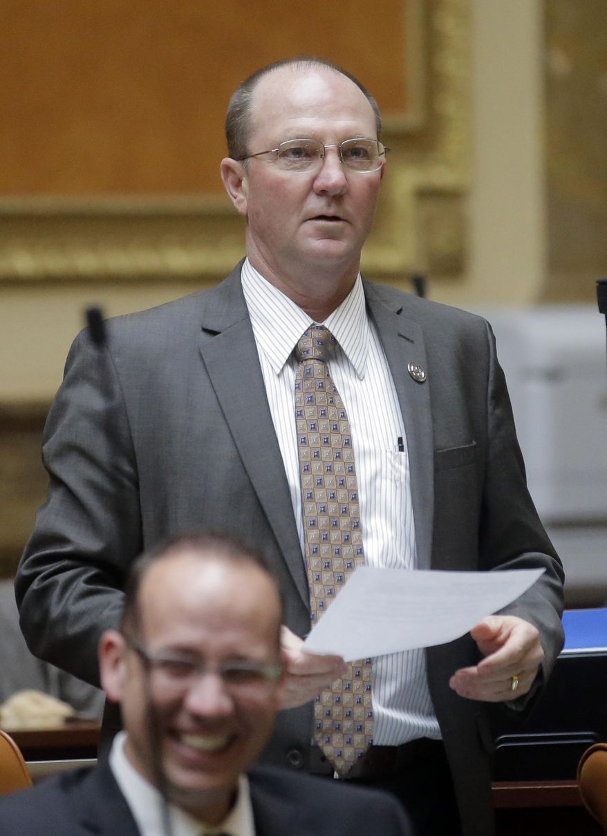 In this photo taken Feb. 22, 2017, Rep. Scott Sandall, R-Tremonton, speaks during the Utah House of Representatives session, at the Utah State Capitol, in Salt Lake City. Gov. Gary Herbert signed 33 bills on Monday, March 20, 2017, including a measure phasing out a tax credit for installing solar panels that legislators said was eating away at money for public schools. A measure from Sandall, exempts small producers of homemade baked goods, jams, jellies and other non-hazardous goods from state food safety inspections. (AP Photo/Rick Bowmer)