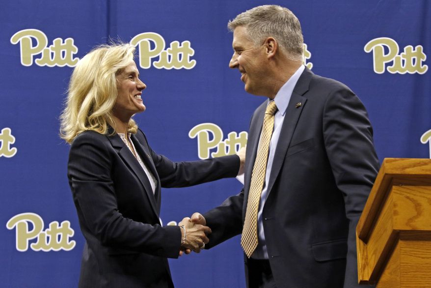 University of Pittsburgh Chancellor Patrick Gallagher, right, introduces Heather Lyke as the scholls new athletic director in Pittsburgh, Monday, March 20, 2017. Lyke was most recently athletic director at Eastern Michigan University. (AP Photo/Gene J. Puskar)