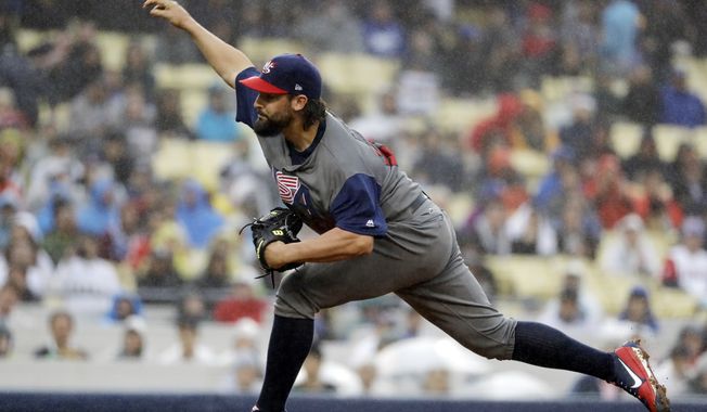 United States&#x27; Tanner Roark throws during the first inning of a semifinal in the World Baseball Classic against Japan in Los Angeles, Tuesday, March 21, 2017. (AP Photo/Chris Carlson)