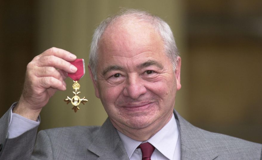 FILE - This is a Oct. 27, 2000 file photo of British author Colin Dexter after receiving an Order of the British Empire. Writer Colin Dexter, who created music-loving Oxford detective Inspector Morse, has died aged 86. Publisher Pan Macmillan said Dexter died Tuesday March 21, 2017 at his home in Oxford England. (John Stillwell/PA, File via AP)