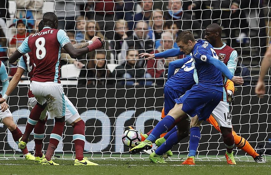 Leicester's Jamie Vardy scores his side's third goal during the English Premier League soccer match between West Ham and Leicester City at London Stadium in London, Saturday, March 18, 2017. (AP Photo/Frank Augstein)