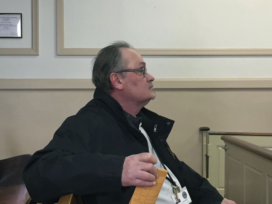 In this Monday, March 20, 2017 photo, Robert J. Guidi sits during a hearing where he pleaded guilty to theft by deception and violating New Jersey's Stolen Valor Act, at the Morris County Courthouse in Morristown, N.J. The Mine Hill, N.J., man, who served in a clerical position as a U.S. Army private during the Vietnam War, exaggerated his military record to get gifts including a nearly $32,000 deck. (Peggy Wright /The Daily Record via AP, Pool)