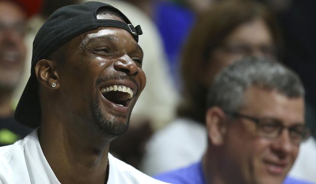 FILE - In this Saturday, Feb. 25, 2017, file photo, Miami Heat forward Chris Bosh smiles during the first half of an NCAA college basketball game between Miami and Duke in Coral Gables, Fla. Bosh never wanted to take games off as a player, and would give anything to be playing right now. So he has a very simple perspective on the NBA&#x27;s rest-or-play debate. &amp;quot;If you can play,&amp;quot; Bosh said, &amp;quot;go out there and play.&amp;quot; (David Santiago/El Nuevo Herald via AP, File)