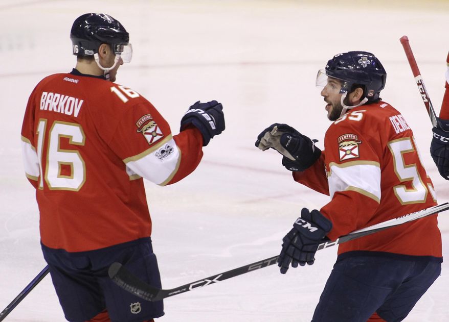 Florida Panthers&#39; Aleksander Barkov, of Finland, (16) celebrates with teammate Jason Demers (55) after scoring a goal against the Carolina Hurricanes during the first period of an NHL hockey game, Tuesday, March 21, 2017, in Sunrise, Fla. (AP Photo/Luis M. Alvarez)