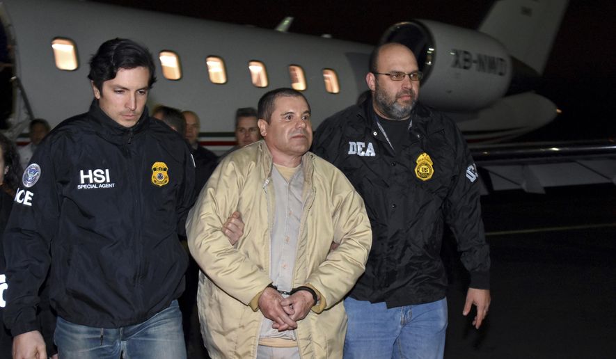 FILE - In this Jan. 19, 2017 file photo provided U.S. law enforcement, authorities escort Joaquin "El Chapo" Guzman, center, from a plane to a waiting caravan of SUVs at Long Island MacArthur Airport, in Ronkonkoma, N.Y. U.S. prosecutors and lawyers for infamous drug lord Guzman are sparring over his tough jail conditions. The government responded in court papers Tuesday, March 21, 2017, by saying the restrictions are appropriate for someone known for escaping twice from prison in Mexico. (U.S. law enforcement via AP, File)