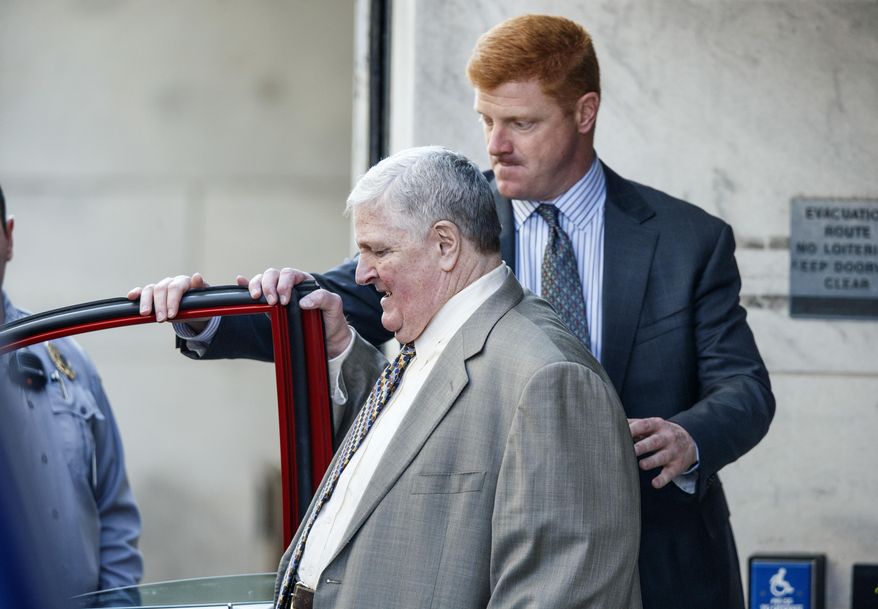 Former Penn State assistant football coach Mike McQueary, and his father John, leave the Dauphin County Courthouse after both testified at the trial of Graham Spanier, Tuesday, March 21, 2017, in Harrisburg, Pa. The failure of Penn State's former president to report child molestation accusations against Jerry Sandusky allowed evil "to run wild," prosecutors said Tuesday at the start of Spanier's trial. (Dan Gleiter/PennLive.com via AP)