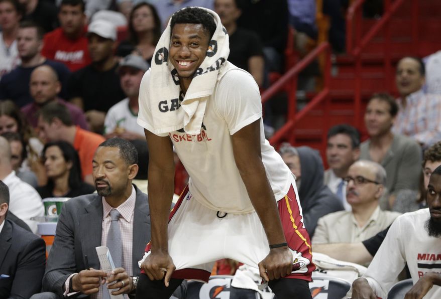 Miami Heat's Hassan Whiteside watches from the bench during the second half of an NBA basketball game against the Phoenix Suns, Tuesday, March 21, 2017, in Miami. The Heat won 112-97. (AP Photo/Lynne Sladky)