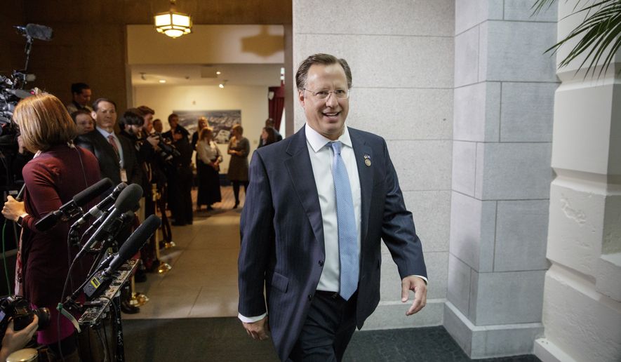Rep. Dave Brat, R-Va., a member of the conservative Freedom Caucus, arrives for the meeting of the Republican Conference with President Donald Trump as he rallied support for the GOP health care bill at the Capitol, in Washington, Tuesday, March 21, 2017. Trump has been trying to persuade reluctant members of the Freedom Caucus to get behind the bill. (AP Photo/J. Scott Applewhite)