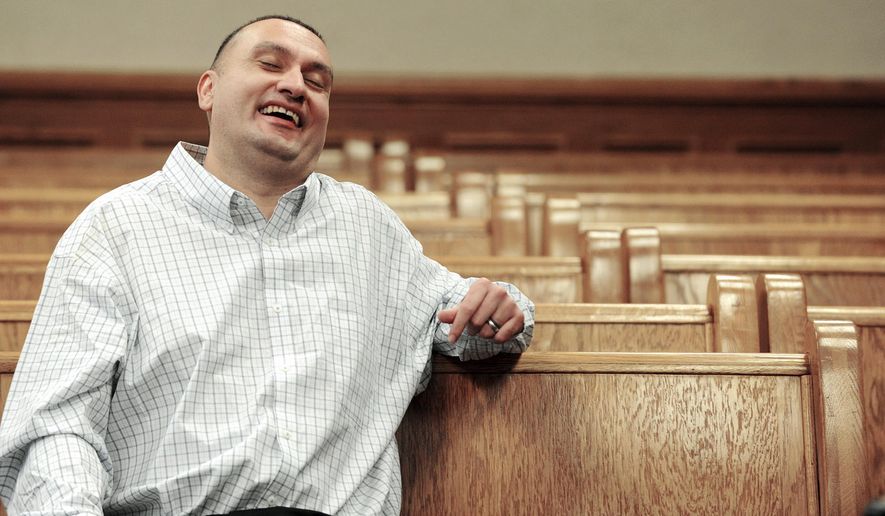 Christopher Tapp smiles during his post conviction relief hearing at the Bonneville Courthouse in Idaho Falls, Idaho, Wednesday, March 22, 2017. Tapp, who experts say was coerced into a false murder confession, is now free after spending half of his life behind bars. A judge released Tapp on Wednesday morning after vacating his rape conviction and re-sentencing him to time served for the 1996 murder of Angie Dodd. (Taylor Carpenter/Post Register via AP, Pool)