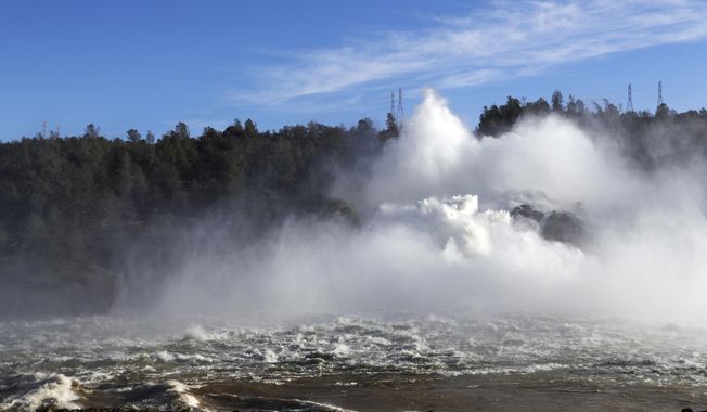 FILE - In this Feb. 14, 2017, file photo water gushes from the Oroville Dam&#x27;s main spillway in Oroville, Calif. A team of experts is warning of a &amp;quot;very significant risk&amp;quot; if the main spillway of the California dam is not operational again by the next rainy season. The warning is contained in a report obtained Wednesday, March 22 by The Associated Press. (AP Photo/Marcio Jose Sanchez, File)