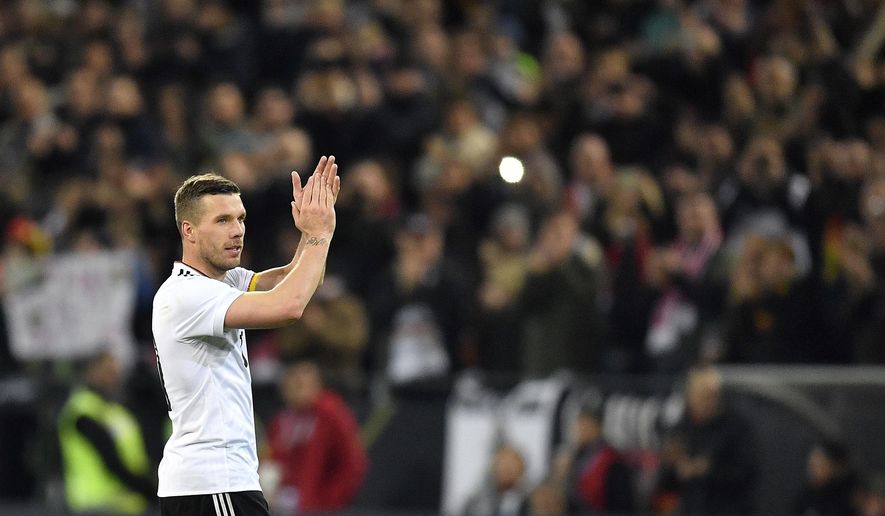 Germany&#39;s Lukas Podolski applauds as he leaves the pitch during the friendly soccer match between Germany and England in Dortmund, Germany, Wednesday, March 22, 2017. (AP Photo/Martin Meissner)