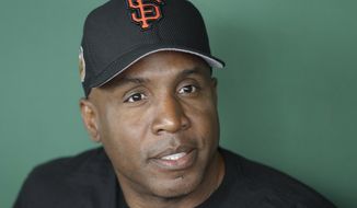 Barry Bonds responds to a question during a news conference Wednesday, March 22, 2017, in Scottsdale, Ariz. Bonds has joined the San Francisco Giants front office as a special adviser. (AP Photo/Darron Cummings)