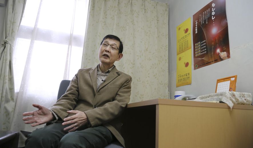 In this March 15, 2017 photo, Shinjiro Shishido, director of "Inochinodenwa", non-profit telephone hotline for people seek help, speaks during an interview, in Tokyo. Fewer Japanese are taking their own lives, a glimmer of hope in a country with one of the world’s highest suicide rates. The number of suicides has dropped for seven straight years in a clear indication of a downward trend. The Health Ministry said Thursday, March 23, 2017, that 21,897 people committed suicide in 2016, down from more than 30,000 in 2011. (AP Photo/Koji Sasahara)