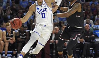 Duke&#39;s Jayson Tatum, left, drives past South Carolina&#39;s Chris Silva, right, during the first half in a second-round game of the NCAA men&#39;s college basketball tournament in Greenville, S.C., Sunday, March 19, 2017. (AP Photo/Rainier Ehrhardt)