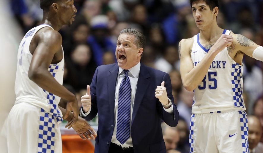 FILE - In this Saturday, March 11, 2017, file photo, Kentucky head coach John Calipari talks to Edrice Adebayo (3) and Derek Willis (35) in the first half of an NCAA college basketball game against Alabama in the semifinals of the Southeastern Conference tournament in Nashville, Tenn. Long considered a football power, the Southeastern Conference is showing some basketball promise. The league has a chance to get three teams in the Elite Eight of the NCAA Tournament, with Kentucky, Florida and South Carolina playing in the Sweet 16 on Friday night. (AP Photo/Wade Payne, File)