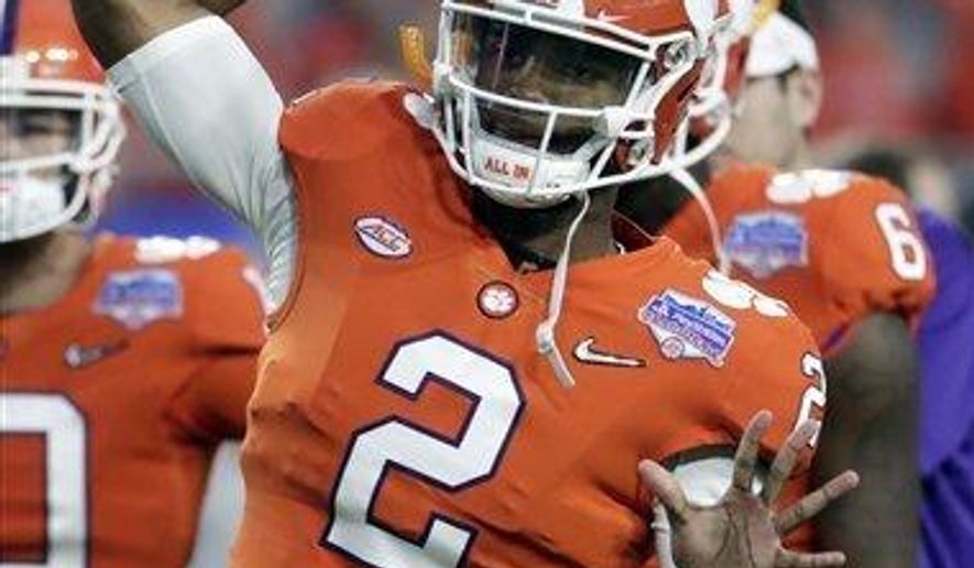 In this Saturday, Dec. 31, 2016, photo, Clemson quarterback Kelly Bryant (2) warms up during the Fiesta Bowl NCAA college football game against Ohio State in Glendale, Ariz. The only downside about having a player such as Deshaun Watson is that it can be hard to convince an elite recruit to come sit behind him for a year or two. That leaves the Tigers with no clear replacement. The holdovers are promising, but not Watson-level talents. (AP Photo/Rick Scuteri)