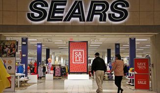 In this Wednesday, Feb. 8, 2017, file photo, shoppers walk into a Sears store in Pittsburgh. Sears said that there is “substantial doubt” that it will be able to remain in business. The company, which runs Kmart and its namesake stores, has struggled for years with weak sales. (AP Photo/Gene J. Puskar, File)