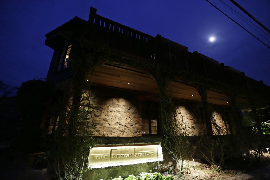 In this photo taken Thursday, March 9, 2017, the moon rises over the French Laundry restaurant in Yountville, Calif. Celebrated chef Thomas Keller has just opened a state-of-the art new kitchen at his famed French Laundry after spending $10 million on an extensive renovation. (AP Photo/Eric Risberg)