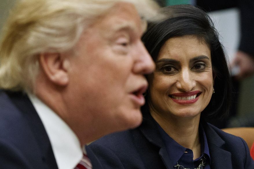 Administrator of the Centers for Medicare and Medicaid Services Seema Verma listen at right as President Donald Trump speaks during a meeting on women in healthcare, Wednesday, March 22, 2017, in the Roosevelt Room of the White House in Washington. (AP Photo/Evan Vucci)