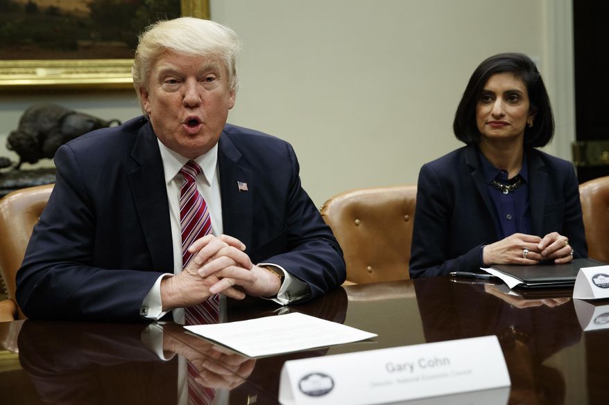 Administrator of the Centers for Medicare and Medicaid Services Seema Verma listens at right as President Donald Trump speaks during a meeting on women in healthcare, Wednesday, March 22, 2017, in the Roosevelt Room of the White House in Washington. (AP Photo/Evan Vucci)