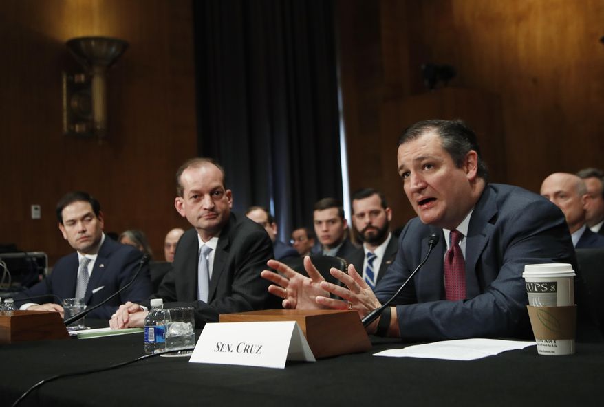 Labor Secretary-designate Alexander Acosta, center, flanked by Sen. Ted Cruz, R-Texas, right, and Sen. Marco Rubio, R-Fla., listens on Capitol Hill in Washington, Wednesday, March 22, 2017, as Cruz introduces him to the Senate Health, Education, Labor and Pensions Committee during his confirmation hearing. (AP Photo/Manuel Balce Ceneta)