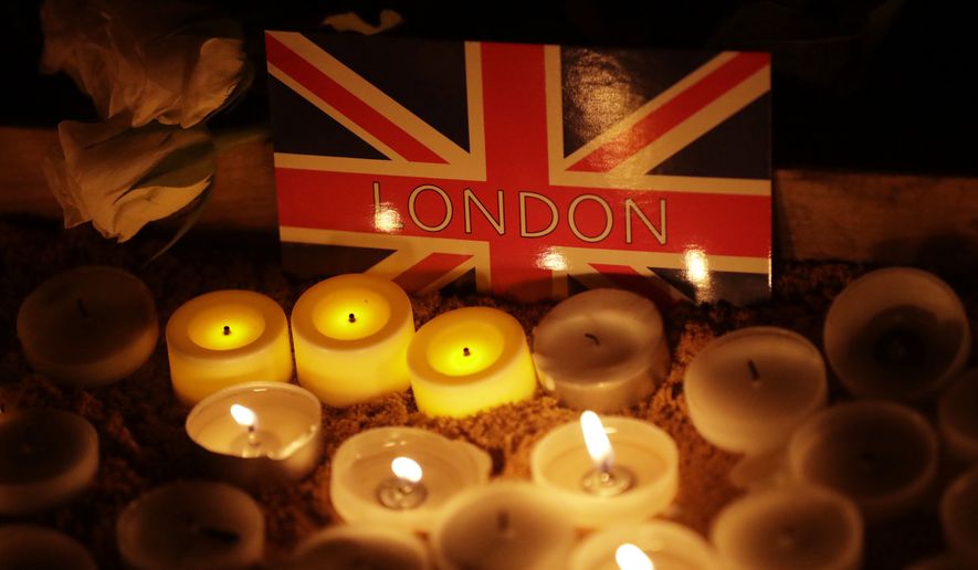 A candlelight vigil was held Thursday for the victims of Wednesday&#39;s attack at Trafalgar Square in London. (Associated Press)
