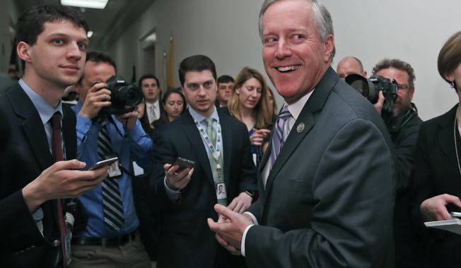 House Freedom Caucus Chairman Rep. Mark Meadows, R-N.C. smiles as he speaks with the media on Capitol Hill in Washington, Thursday, March 23, 2017, following a Freedom Caucus meeting. GOP House leaders delayed their planned vote on a long-promised bill to repeal and replace &quot;Obamacare,&quot; in a stinging setback for House Speaker Paul Ryan and President Donald Trump in their first major legislative test.  (AP Photo/Alex Brandon)