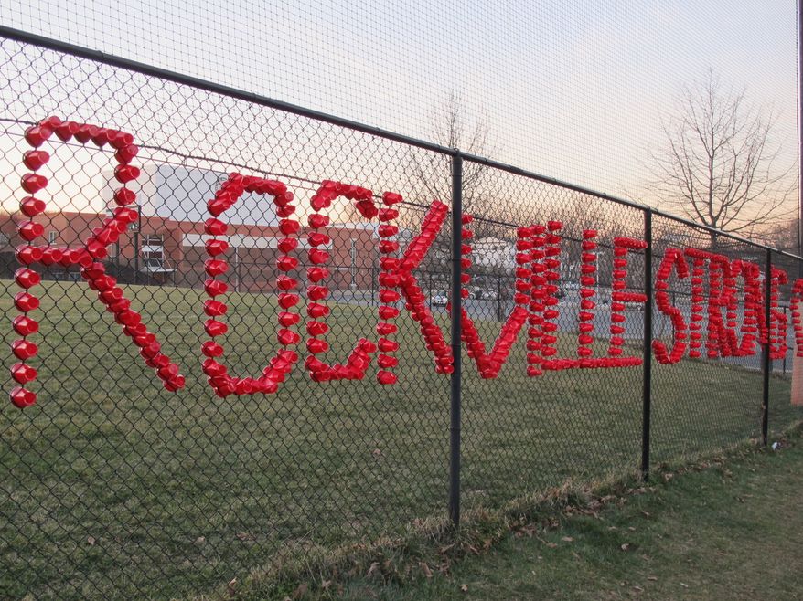 Plastic cups spell out Rockville Strong, at Rockville High School in Rockville, Maryland, on Thursday, March 23, 2017. The school has been thrust into the national immigration debate after a 14-year-old student said she was raped in a bathroom, allegedly by two classmates, including one who authorities said came to the U.S. illegally from Central America. (AP Photo/Brian Witte)