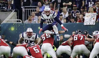 FILE - In this Feb. 5, 2017, file photo, New England Patriots&#x27; Shea McClellin (58) leaps over the line of scrimmage in an attempt to block a kick during the first half of the NFL Super Bowl 51 football game in Houston. NFL owners will consider proposals next week to cut regular-season overtime from 15 minutes to 10; eliminate players leaping over the line on kick plays; and expansion of coaches&#x27; challenges and what can be reviewed by officials.   (AP Photo/Jae C. Hong, File)