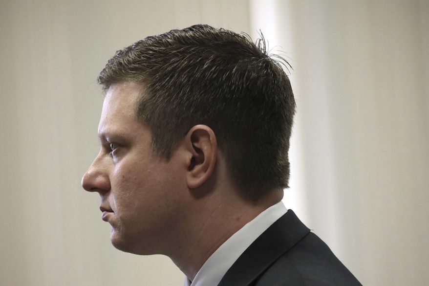 Former Chicago Police Officer Jason Van Dyke attends a hearing in front of Judge Vincent Gaughan at the Leighton Criminal Courts Building Thursday, March 23, 2017 in Chicago. A grand jury has added 16 counts of aggravated battery with a firearm to the first-degree murder charges against Van Dyke, accused in the 2014 fatal shooting of a black 17-year-old. (Nancy Stone/Chicago Tribune via AP, Pool)