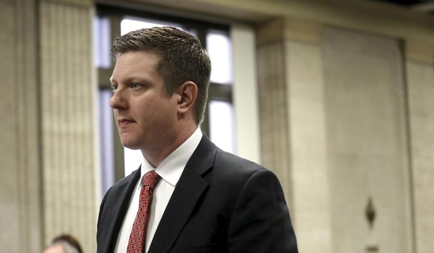 Former Chicago Police Officer Jason Van Dyke attends a hearing in front of Judge Vincent Gaughan at the Leighton Criminal Courts Building Thursday, March 23, 2017 in Chicago. A grand jury has added 16 counts of aggravated battery with a firearm to the first-degree murder charges against Van Dyke, accused in the 2014 fatal shooting of a black 17-year-old. (Nancy Stone/Chicago Tribune via AP, Pool)