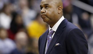 FILE - In this Jan. 2, 2016, file photo, Georgetown head coach John Thompson III reacts during the second half of an NCAA college basketball game against Marquette in Washington.  Georgetown has fired basketball coach John Thompson III on Thursday, March 23, 2017, after two consecutive losing seasons at the school his father led to a national championship. (AP Photo/Alex Brandon File)