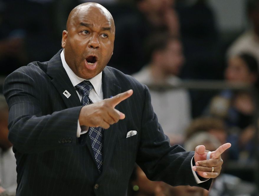 FILE - In this Nov. 22, 2015, file photo, Georgetown head coach John Thompson III gestures toward his players during the first half of an NCAA college basketball game against Duke at Madison Square Garden in New York. Georgetown has fired basketball coach John Thompson III on Thursday, March 23, 2017, after two consecutive losing seasons at the school his father led to a national championship. (AP Photo/Kathy Willens, File)