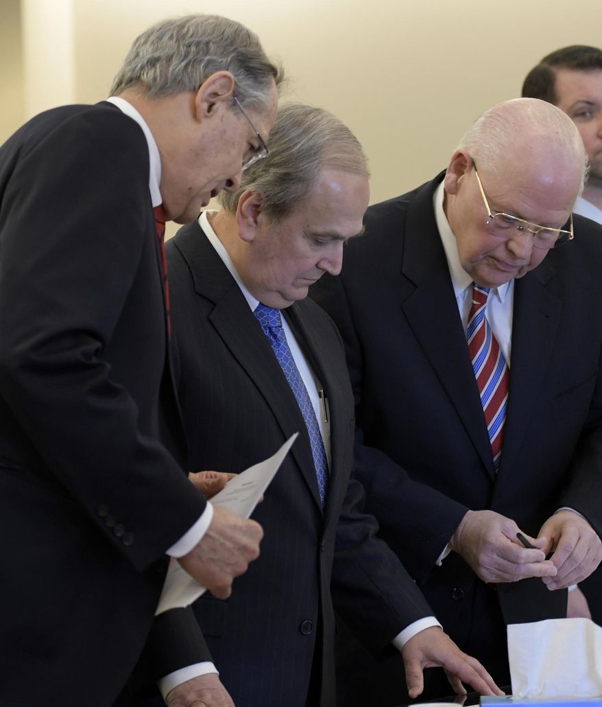 Former Republican Sen. George Maziarz, second from left, with his attorneys E. Stewart Jones of Troy, left, and Joe Latona of Buffalo, center, stands before Judge Peter Lynch for his arraignment in Albany County Court, Thursday, March 23, 2017, in Albany, N.Y. Maziarz, pleaded not guilty to charges that he used campaign money to secretly pay an ex-staffer accused of sexual harassment. (Skip Dickstein/Times Union, via AP)