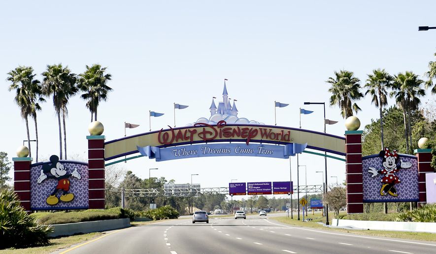 In this Tuesday, Jan. 31, 2017 photo, cars travel one of the roads leading to Walt Disney World in Lake Buena Vista, Fla. (AP Photo/John Raoux)