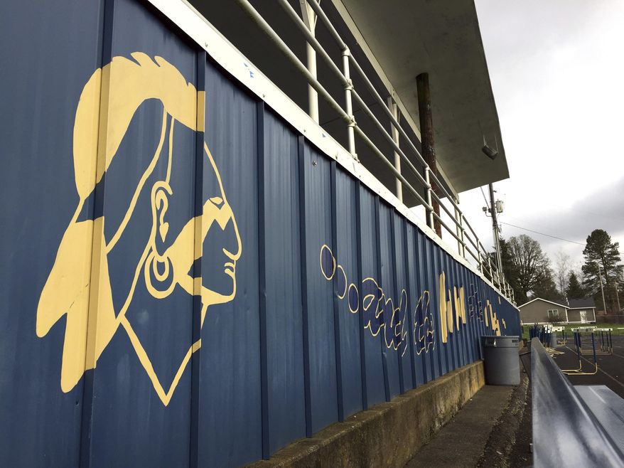 The Banks High School mascot is visible on the side of the football stands at the school in Banks, Ore., Thursday, March 23, 2017. In Oregon, school districts with Native American mascots must abandon them by July or risk punishment that could include the withholding of state funds. But with the approval of the state, a handful of districts are working with tribes to keep some version of their mascots in exchange for concessions, including better classroom lessons on the history and culture of the state's many tribes. (AP Photo/Gillian Flaccus)