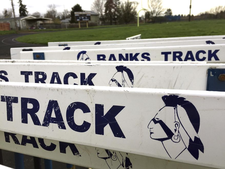 The Banks High School mascot is visible on track hurdles at the school in Banks, Ore., Thursday, March 23, 2017. In Oregon, school districts with Native American mascots must abandon them by July or risk punishment that could include the withholding of state funds. But with the approval of the state, a handful of districts are working with tribes to keep some version of their mascots in exchange for concessions, including better classroom lessons on the history and culture of the state's many tribes. (AP Photo/Gillian Flaccus)